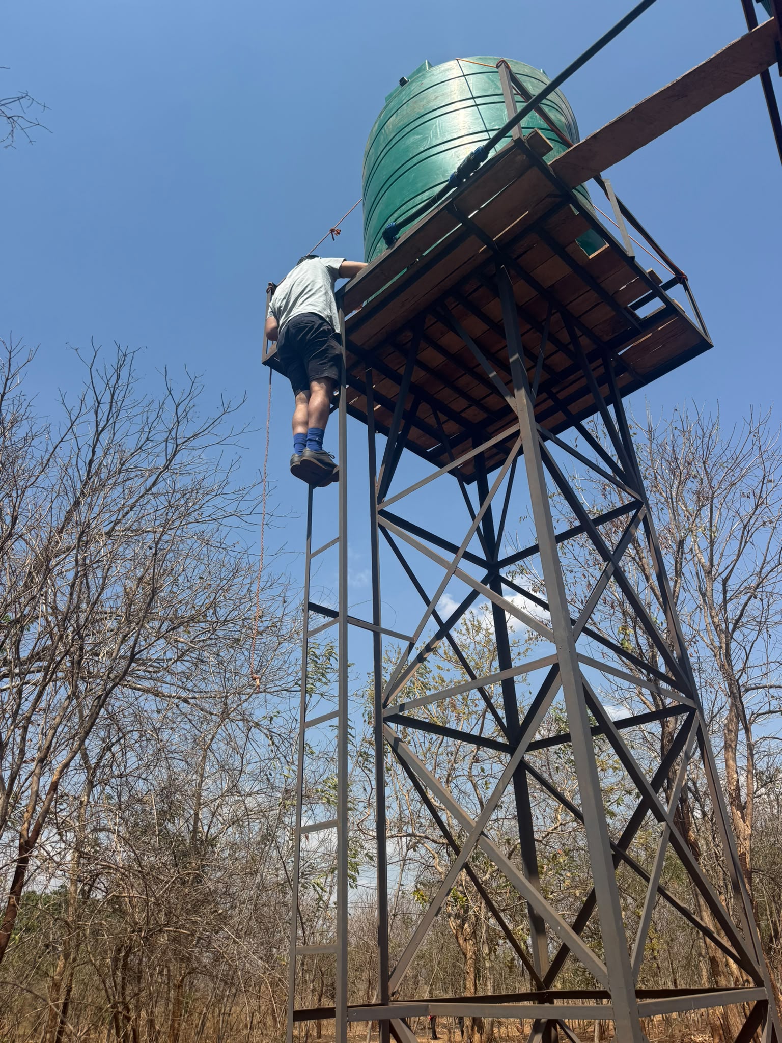 Checking the new water tank at John Hunt Primary School.
